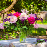 Mixed perennial flowers growing in a colorful cutting garden.