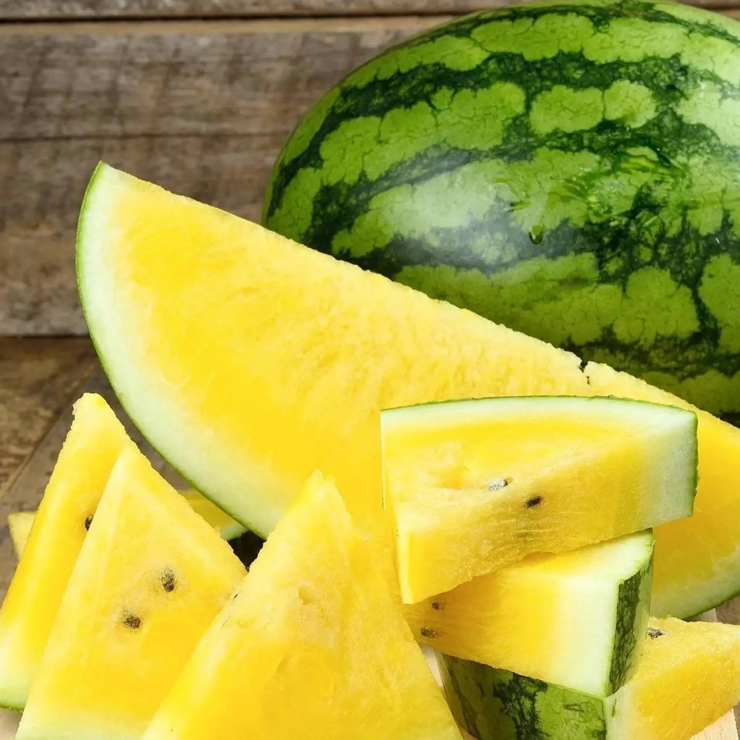 Rare heirloom yellow watermelon in a home vegetable garden.